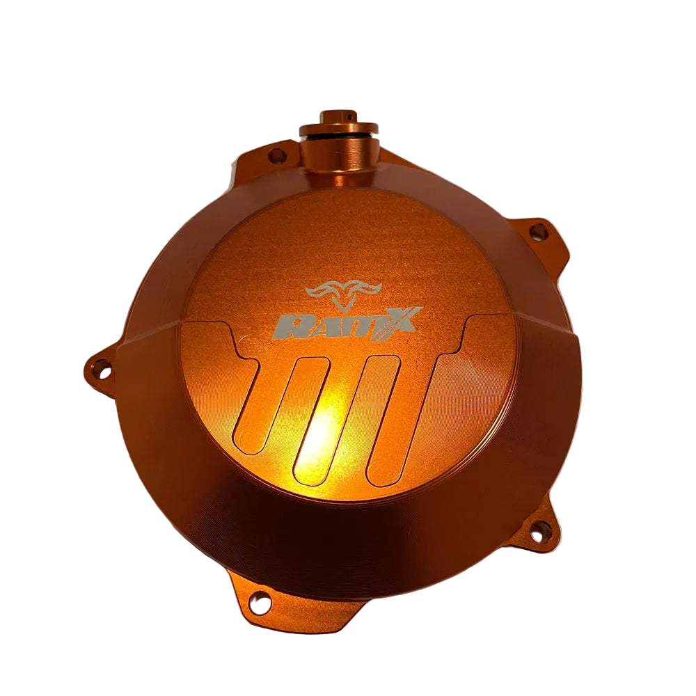 An anodized copper-orange metal motorcycle engine cover featuring a silver 'Brix' logo, photographed on a plain off-white background.